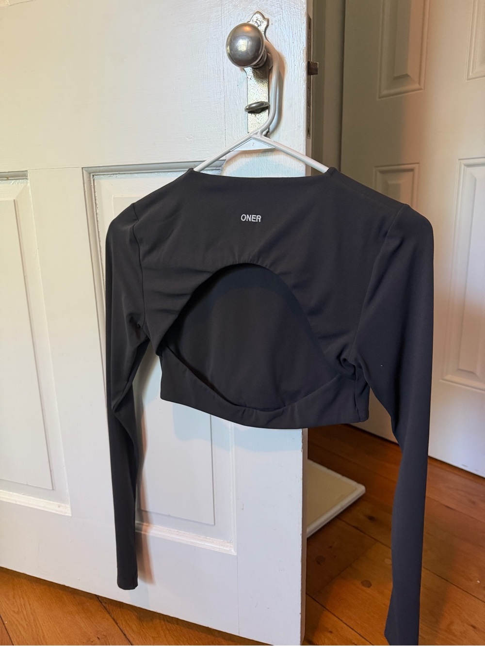 New Oner Long-Sleeve Open-Back Crop Top — OUT OF STOCK ONLINE in black - Picture 2 of 4